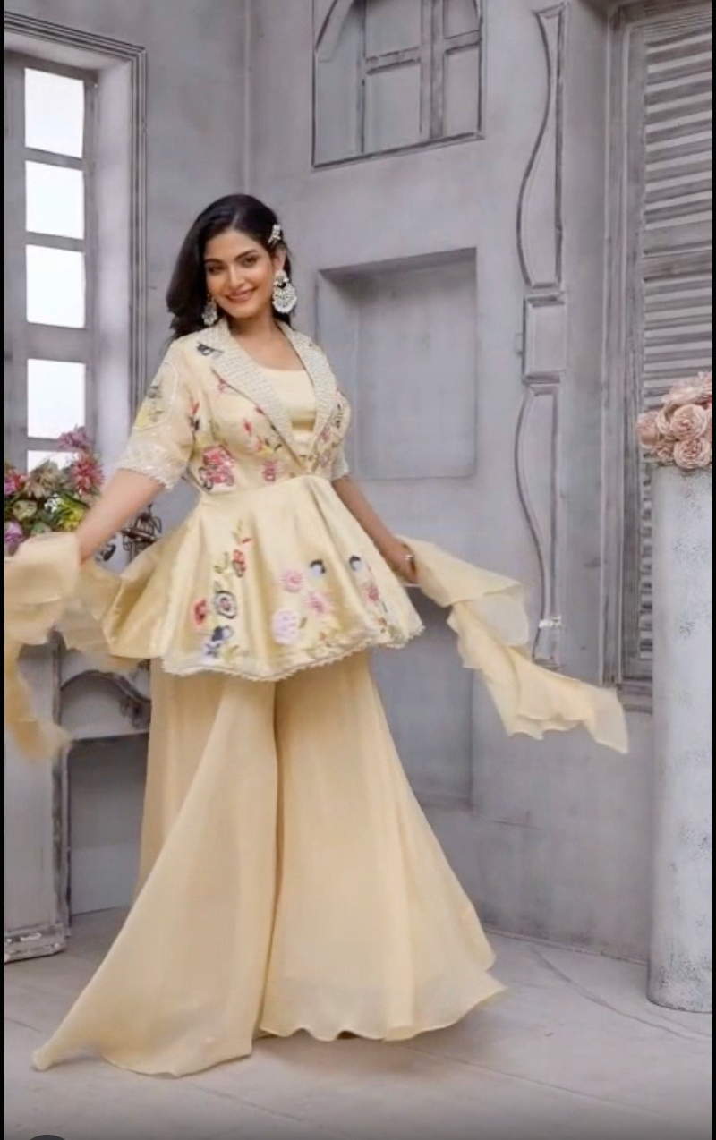 Beige color peplum with it gazal gupta culture hand work touch on it with pure crape palazo