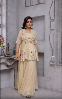 Beige color peplum with it gazal gupta culture hand work touch on it with pure crape palazo