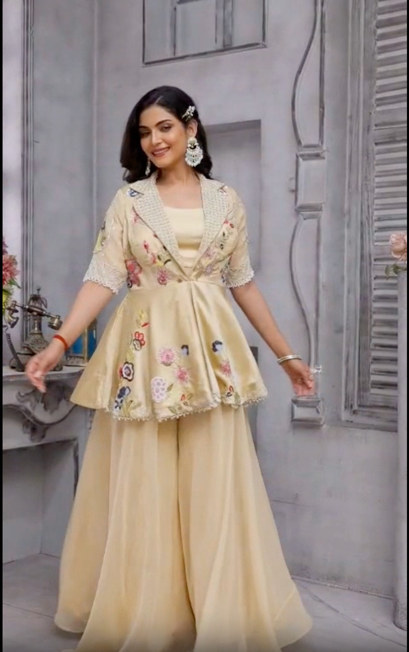 Beige color peplum with it gazal gupta culture hand work touch on it with pure crape palazo